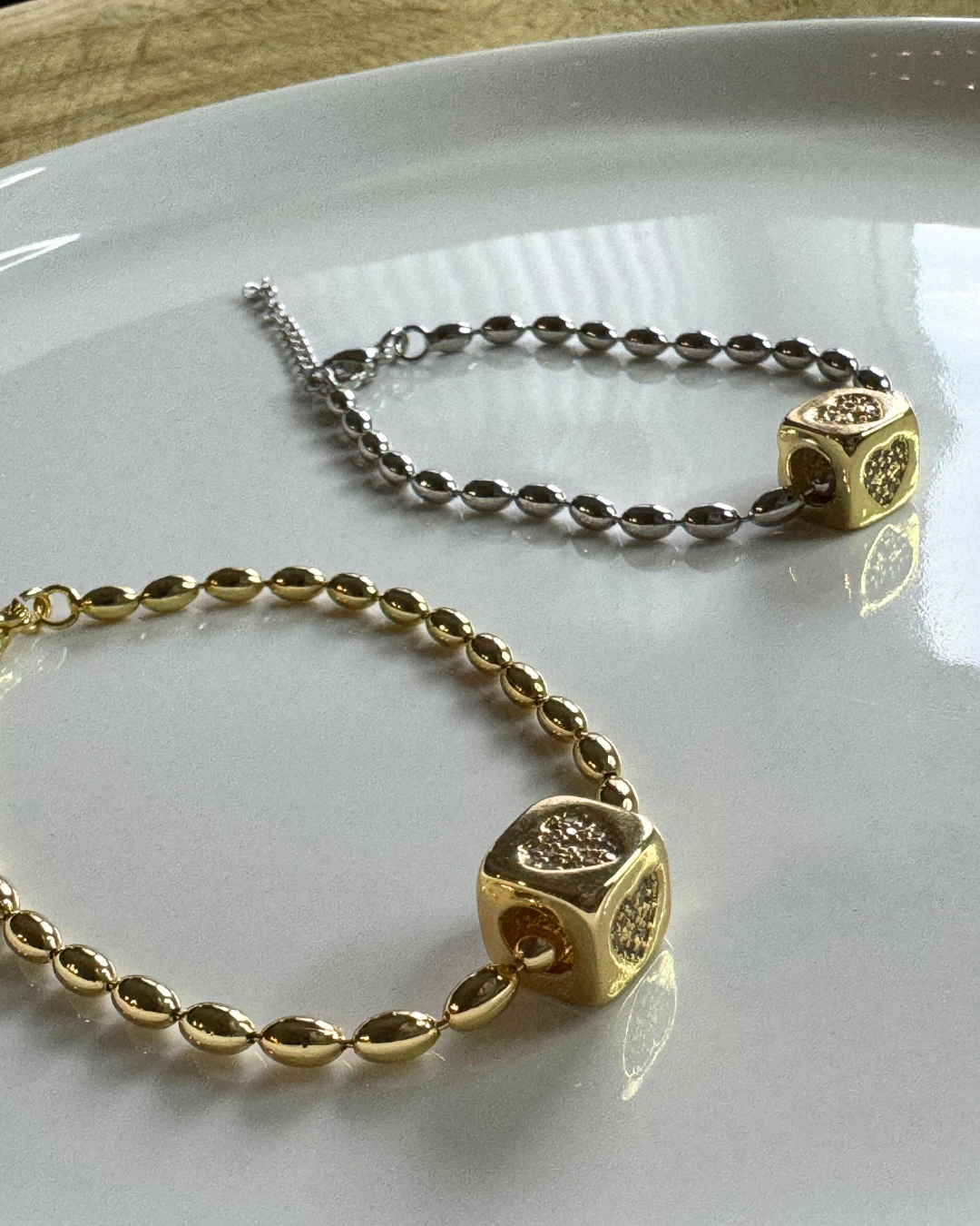 TEAR CHAIN SILVER BRACELET AND GOLD HEART CUBE