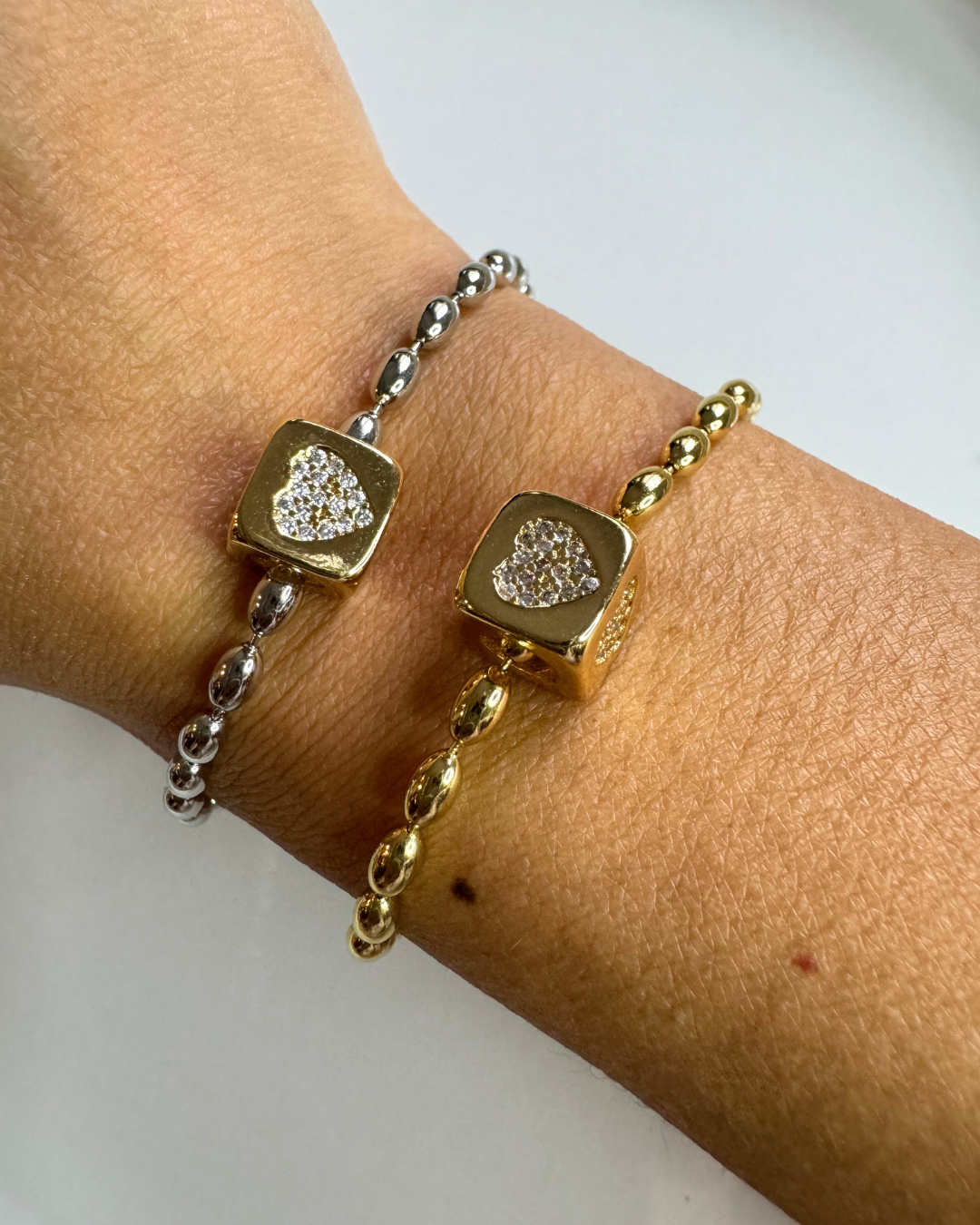 TEAR CHAIN SILVER BRACELET AND GOLD HEART CUBE